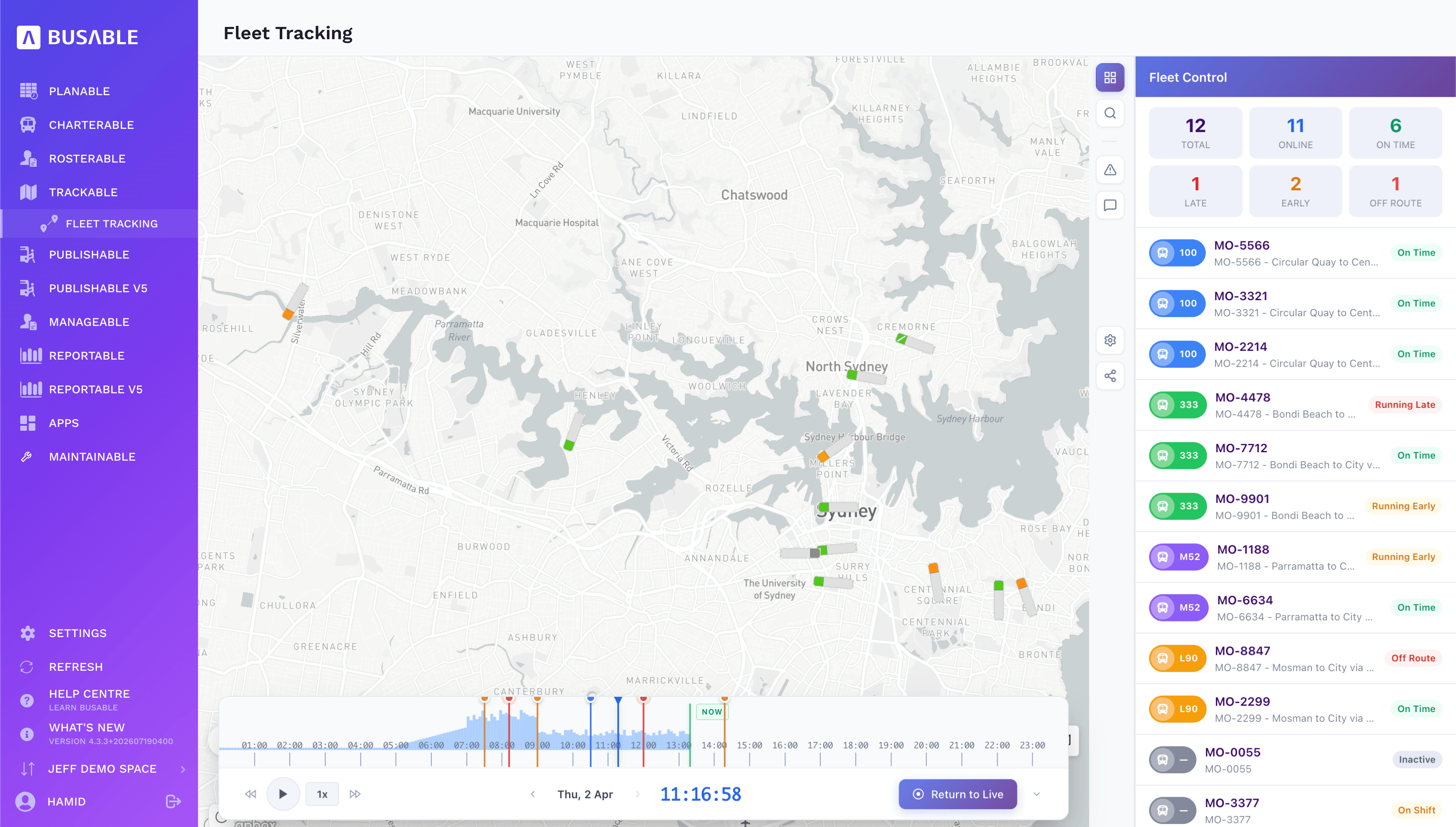 Live fleet map with vehicles colour-coded by status, fleet control counts and a timeline scrubber